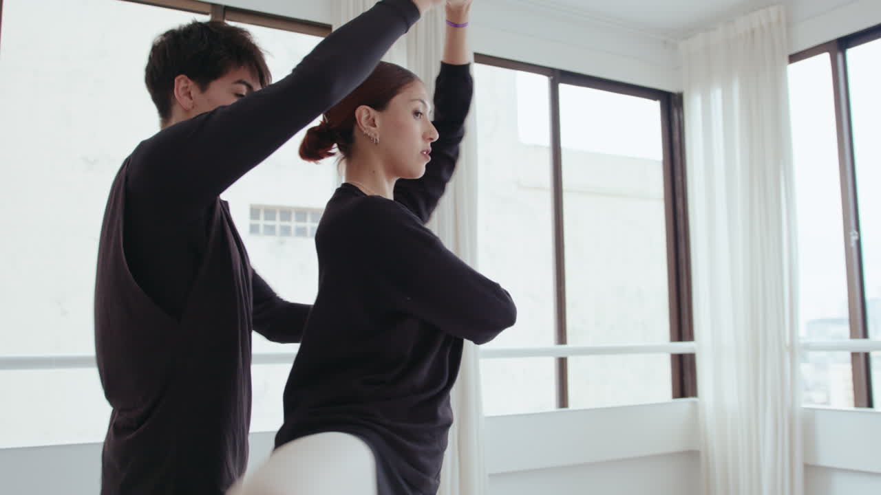 Young Ballet Dancers Practicing Partnered Pirouette in Studio