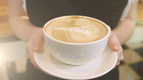 animation of light spots over hands of caucasian woman holding cup of coffee