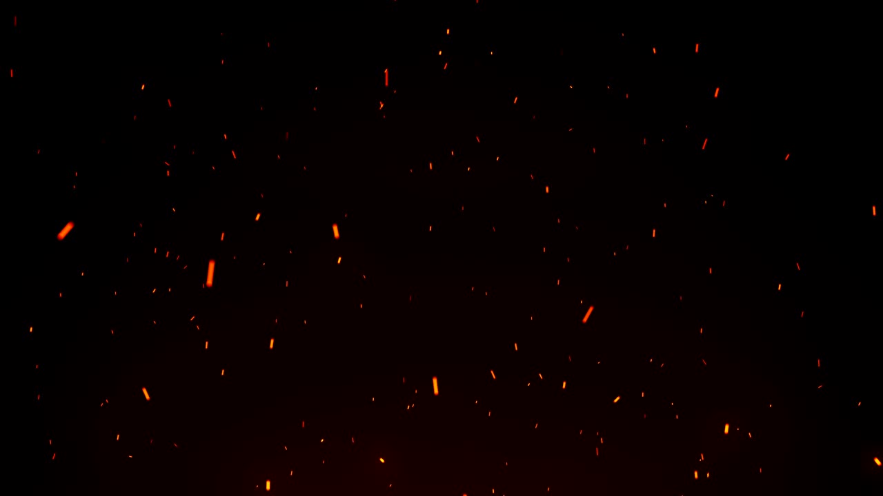 Seamless firestorm texture on black background, shot of flying fire sparks in the air