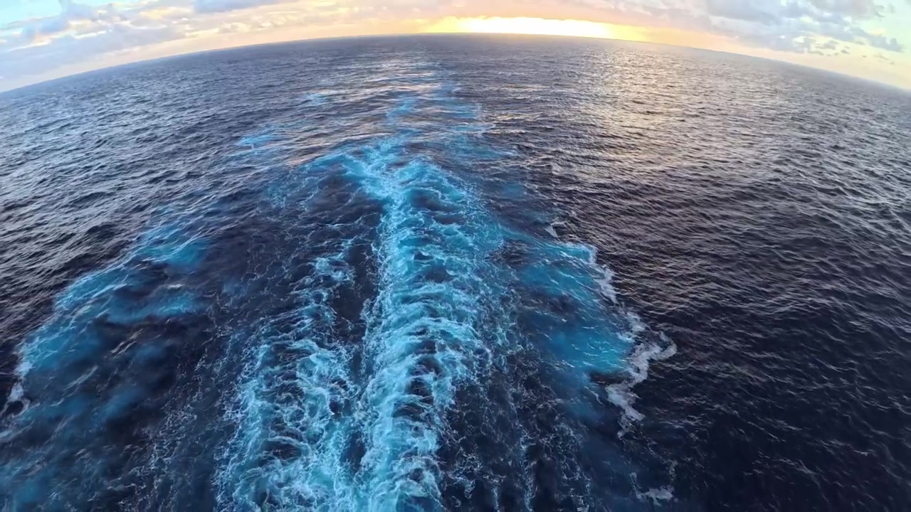 Wide Angle View of Boat Wake on the Ocean at Sunset