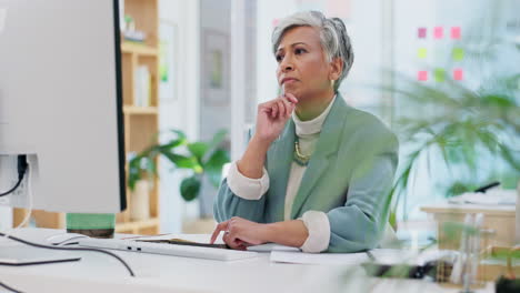 computer, thinking and senior business woman