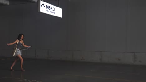 Happy woman walking in the parking garage,4k