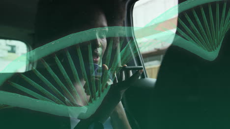 dna strand animation over person talking on smartphone in car