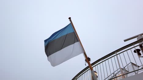 waving estonian flag on the tallinn helsinki ferry