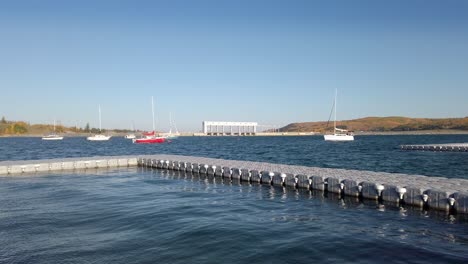 Sailboats-on-a-lake-dock-dam-pan-Ghost-lake-Alberta-Canada