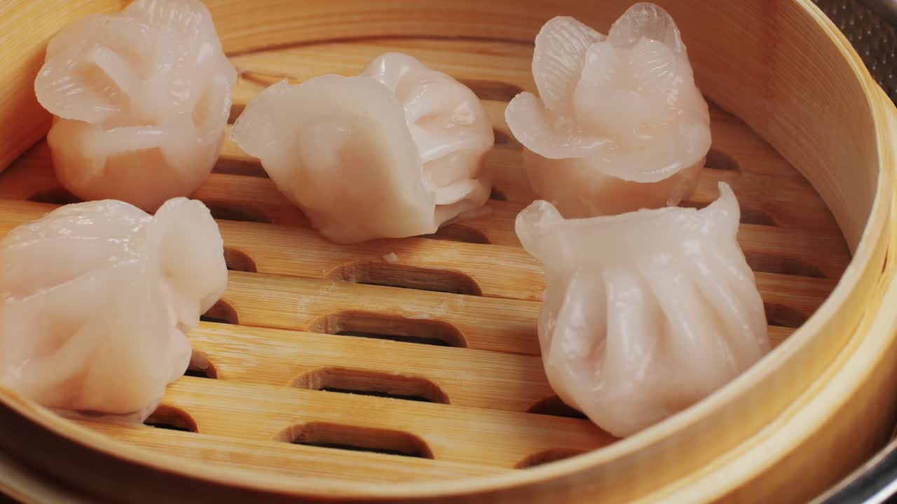 Steamed dumplings in a bamboo steamer