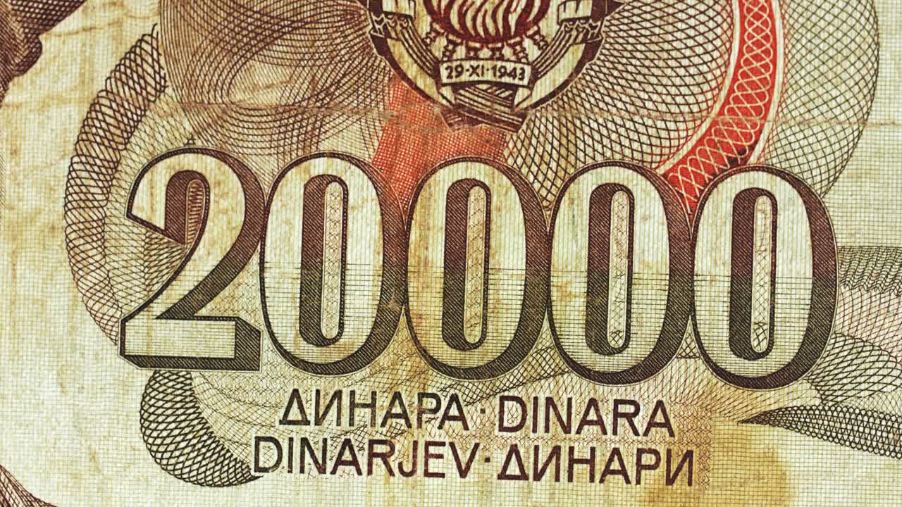 Yugoslavia twenty thousand dinar banknote obverse with large numeral rotating on black background