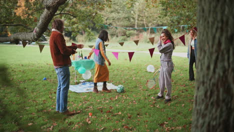 friends having fun in the park on a fall day