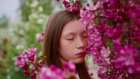 girl in pink blossom garden