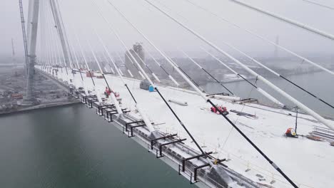 large scale bridge construction megaproject in aerial view during winter