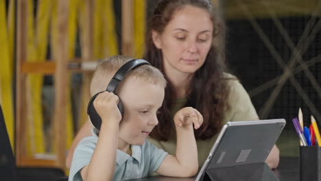 boy and mother learning together on a tablet