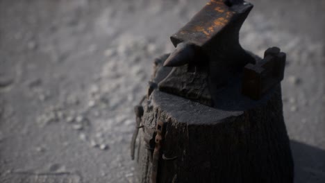 old anvil attached to a stump