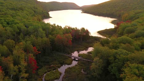 pan up over lake of the clouds in porcupine mountains state park during sunrise