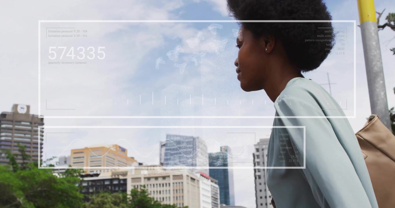 Looking at cityscape, person with afro hairstyle analyzing animation data overlay