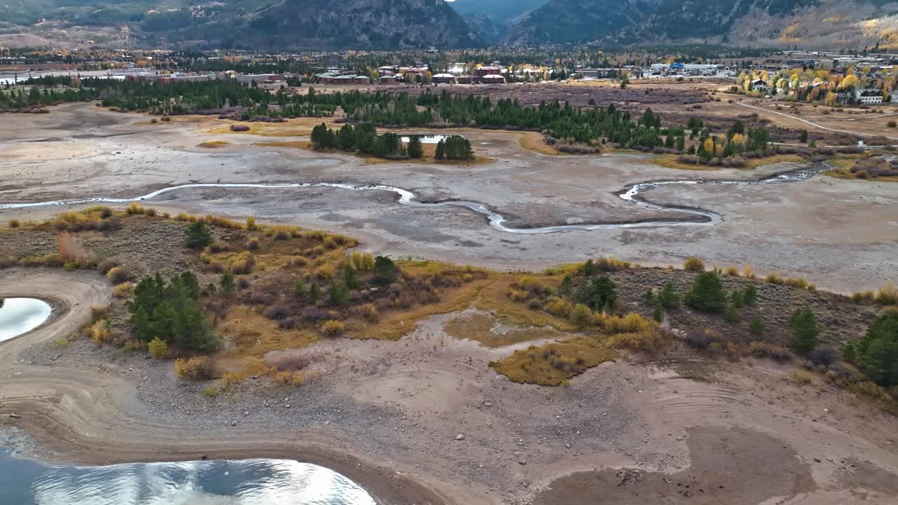 Aerial View of a Dry Riverbed in a Mountain Valley During Autumn