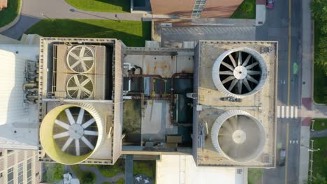 top down aerial view looking down air conditioning unit fans on rooftop