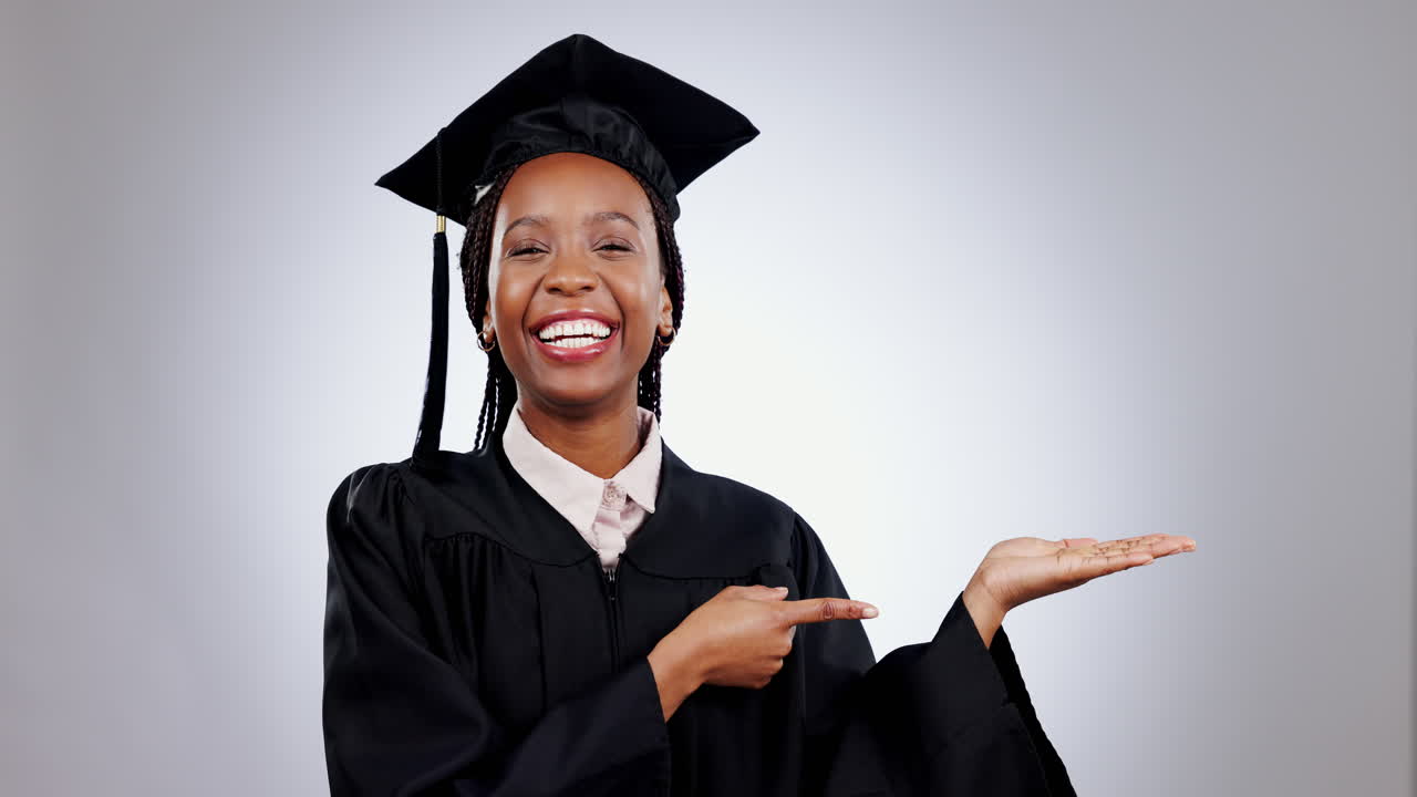 Graduate, black woman and pointing at hand space