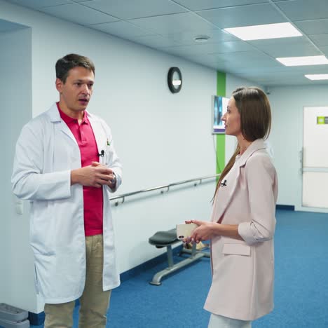 doctor talking to female patient