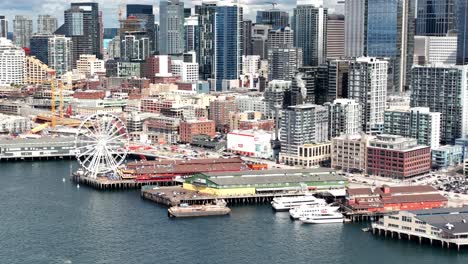 seattle, washington city skyline and waterfront and great wheel ferris wheel - aerial