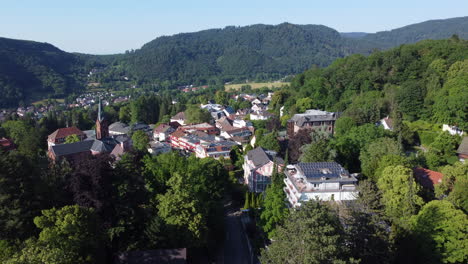 aerial pullback over spa town of badenweiler set in lush countryside, germany