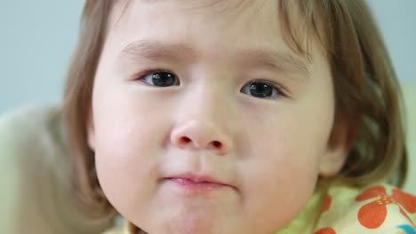 Close-up-portrait-of-cute-Ukrainian-3-year-old-girl-looking-at-camera,-eyes-push-in