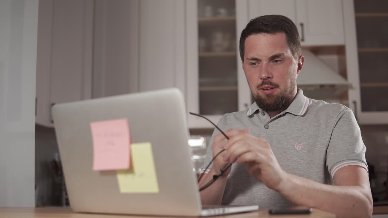Man working on laptop at home