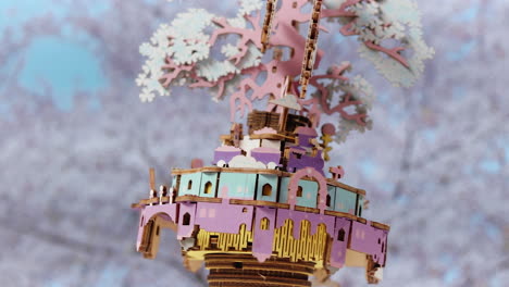 rotating 3d wooden puzzle hand crank music box toy with cherry blossom tree on top