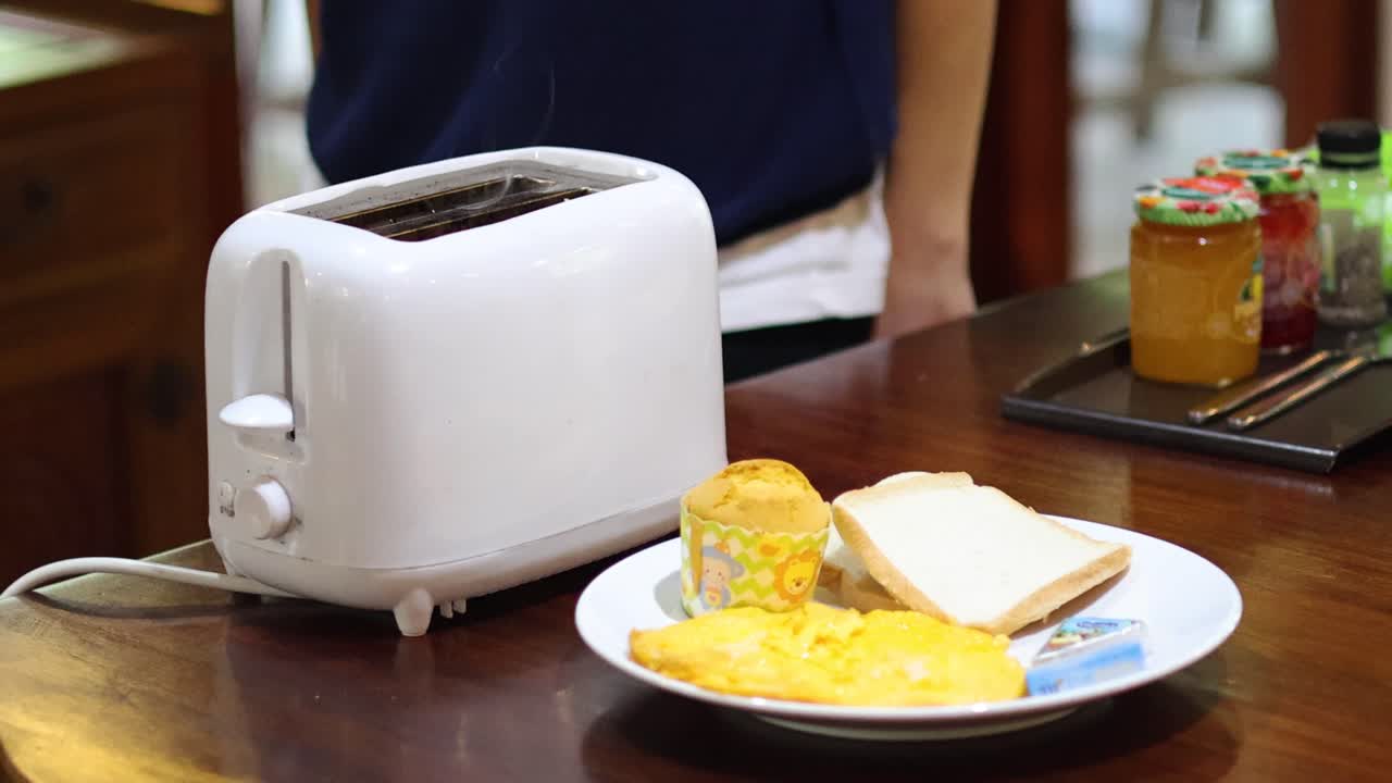 Making toast and serving breakfast on table