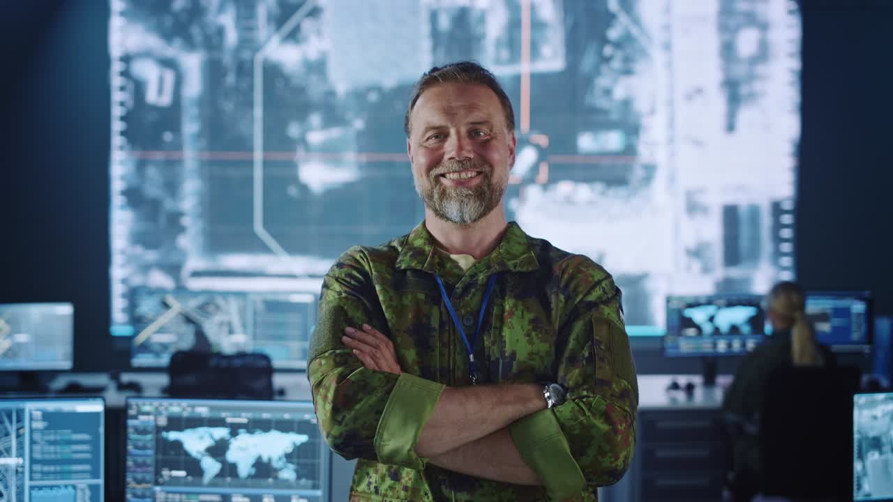 Military Officer Posing in Front of the Camera and Smiling. He in Standing in Surveillance Office for Cyber Operations and Monitoring for Managing National Security, Technology and Army Communications