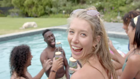 young caucasian woman enjoys a pool party