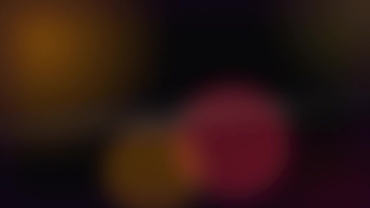Nền trừu tượng với ánh sáng bokeh đỏ và vàng rực rỡ dịu nhẹ
