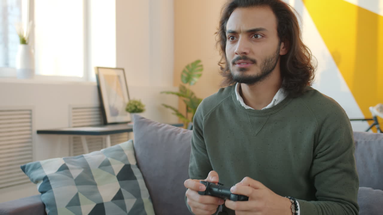 Man Playing Video Game on Couch