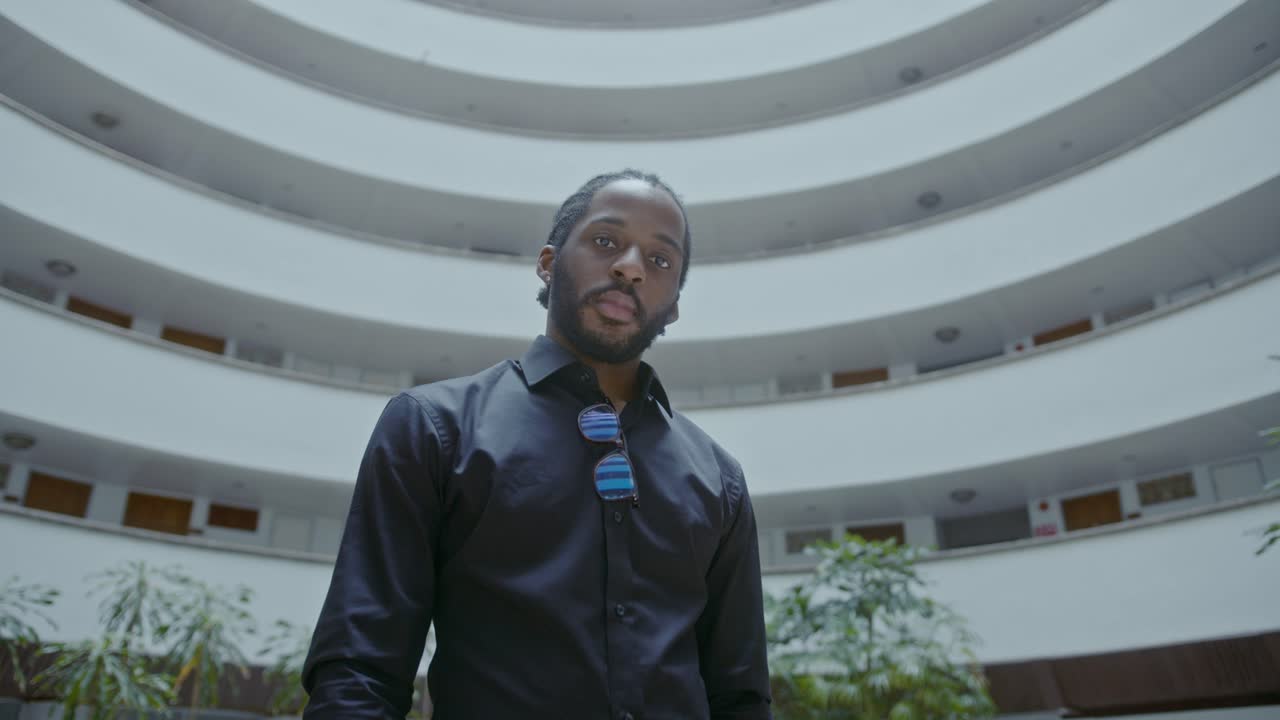 A man in a black shirt in a building