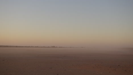 dawn view into the desert in africa with fog