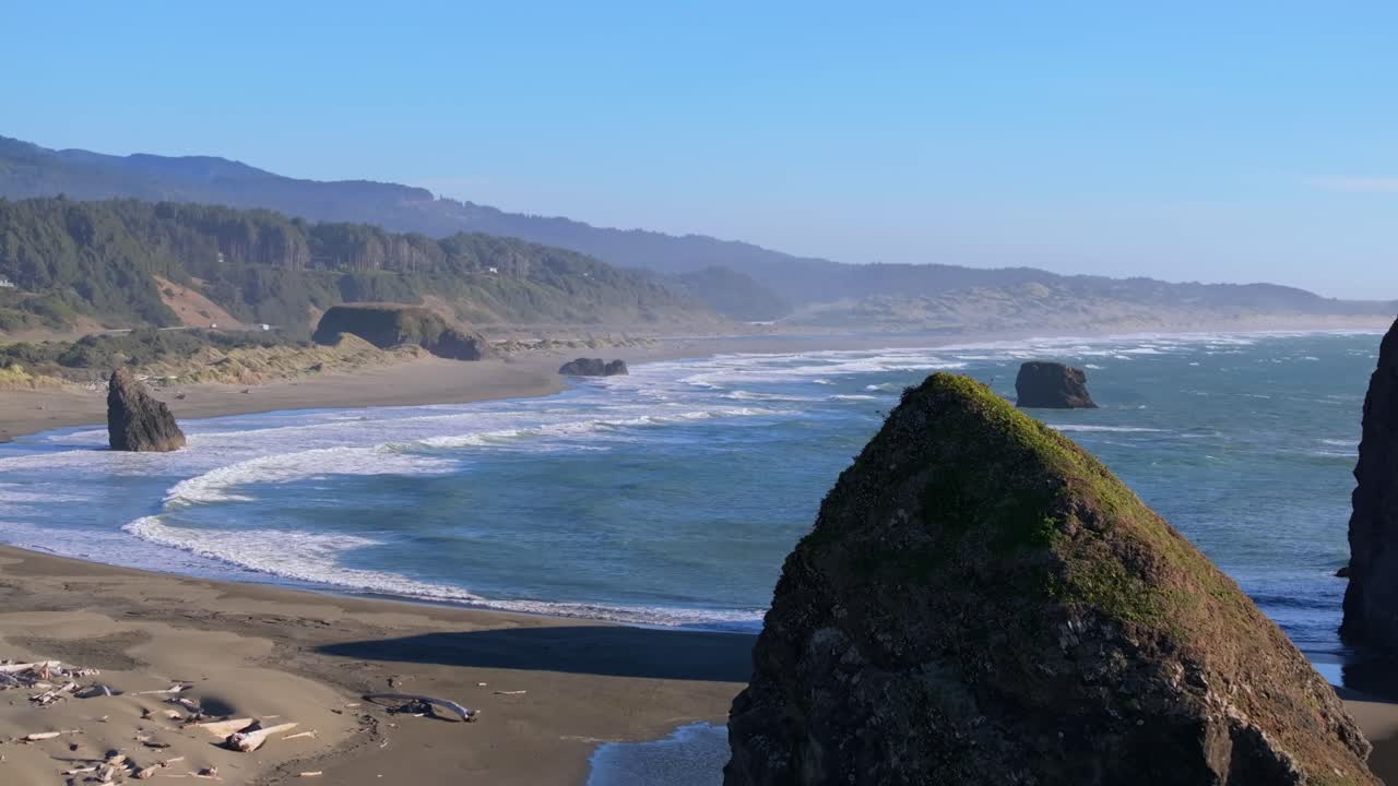 Peaceful Oregon Coast beach with waves and scenic ocean view
