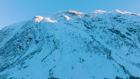 Lateral track of snow mountain's valley with beautiful lights