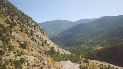a highway in colorado with a amazing mountain vista and busy traffic