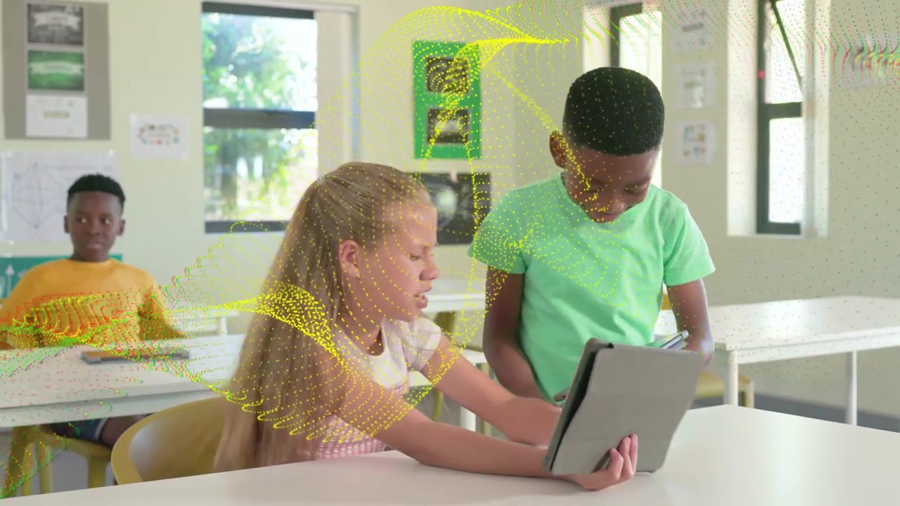 Seated pupil shifting tablet, standing peer leaning and tapping screen, yellow lines guiding lesson