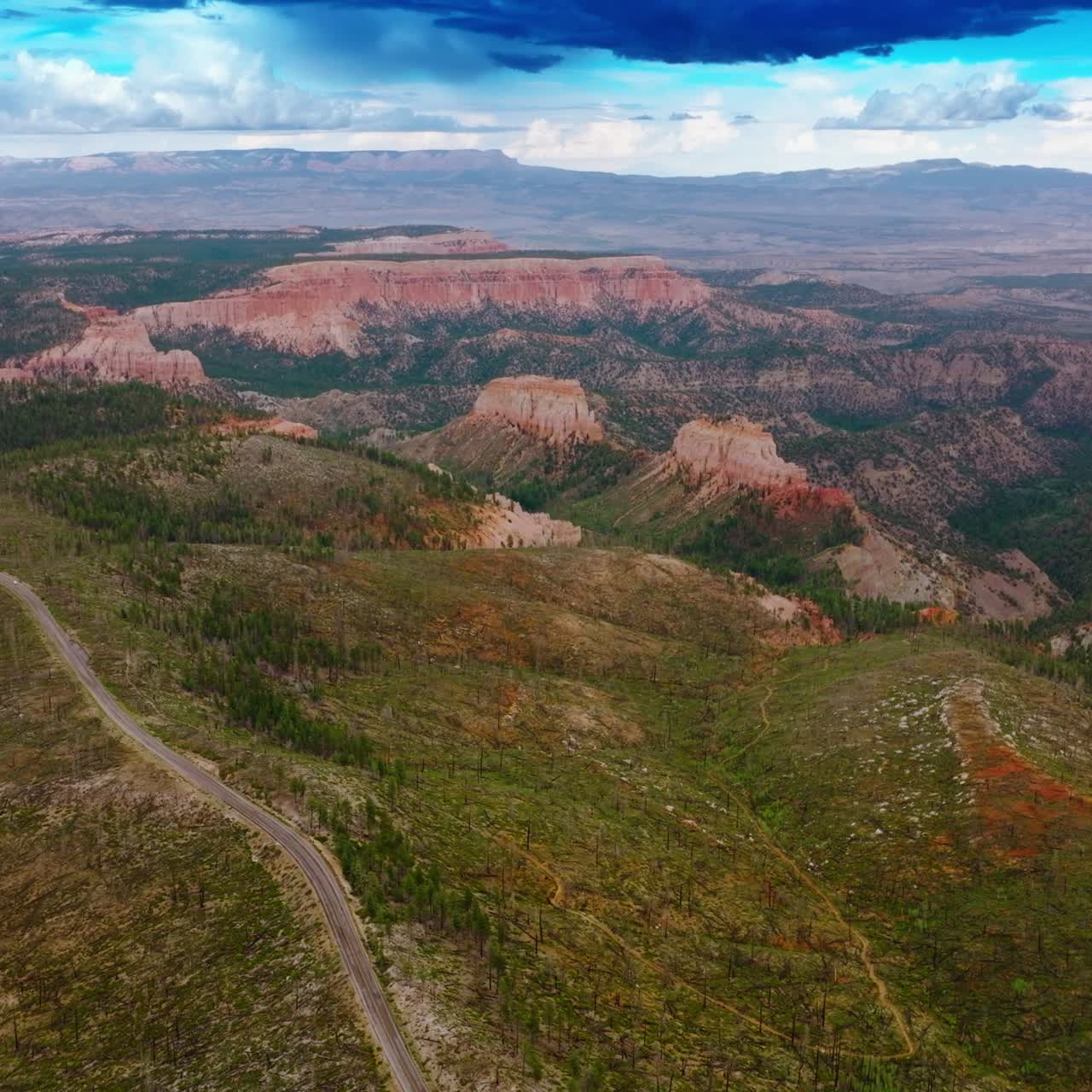 Azure cloudy skies over the mountainous landscape of Utah canyons. Beautiful rocks of Zion National park from top view