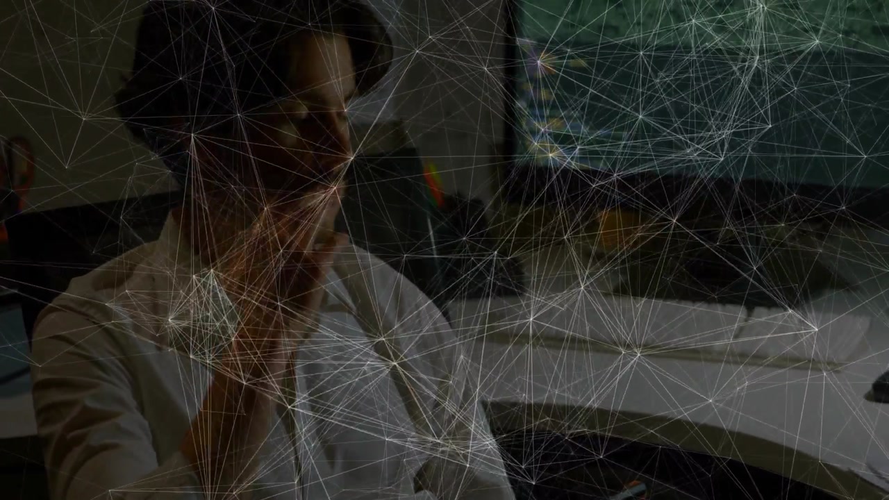 Office worker tapping smartphone and calling then shifting to dual monitors showing business data