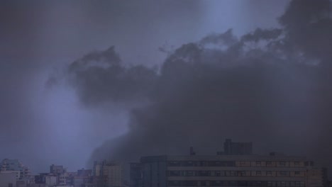 lightning in clouds over a city