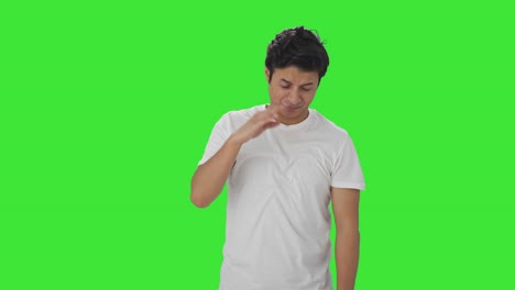 Indian-man-smelling-something-bad-Green-screen