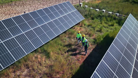 team walking at solar panel plant for inspection