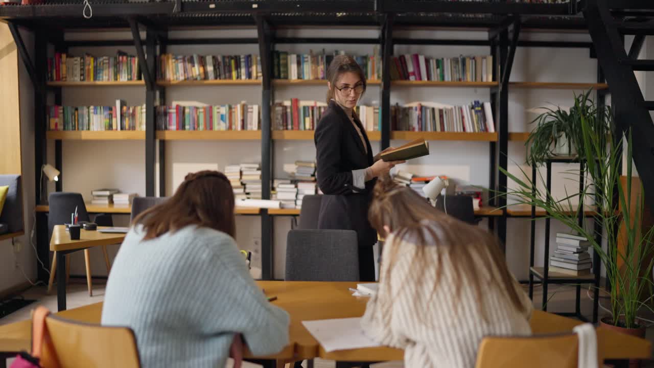 Students studying in a modern library cafe