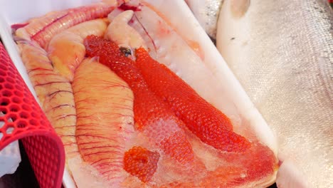 fresh salmon roe and salmon fish at a market