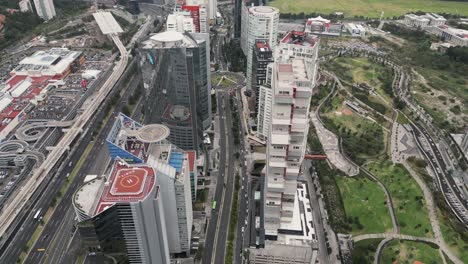 Buildings-on-Santa-Fe-Avenue-next-to-La-Mexicana-Park,-Lomas-de-Santa-Fe,-Mexico-City