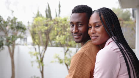 embracing outdoors, smiling african american couple enjoying quality time together, copy space