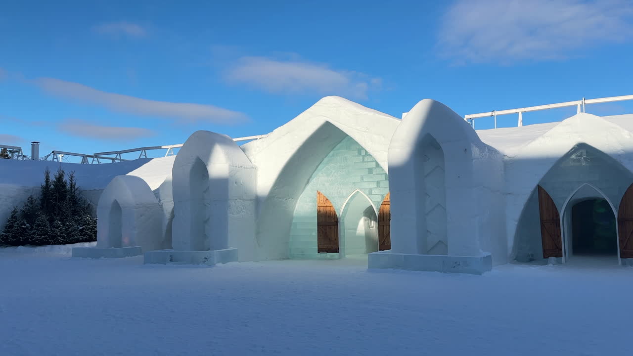 Hôtel de Glace ice hotel in Quebec with snow architecture, exterior of building