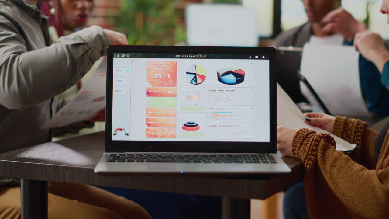 Multiethnic group of coworkers analyzing business charts