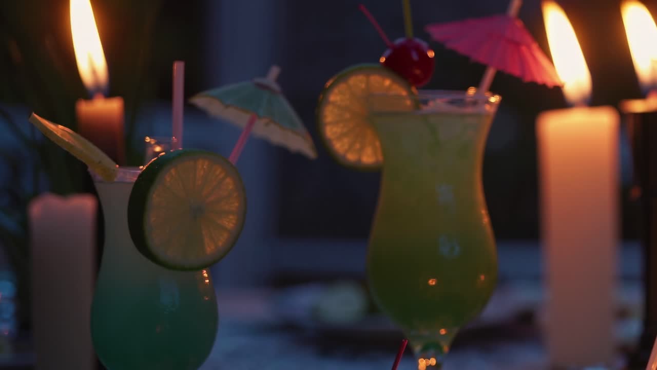 Two tropical cocktails glowing in warm candlelight during a romantic evening, creating a magical ambiance that invites feelings of love and togetherness, perfect for celebrating special moments